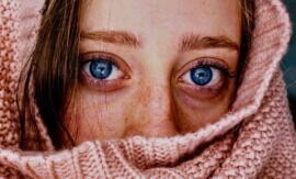 close up of woman with very blue eyes