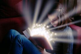 girl reading magical book