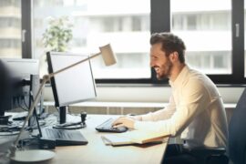 happy man at work desk