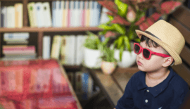 hip kid in sunglasses and hat