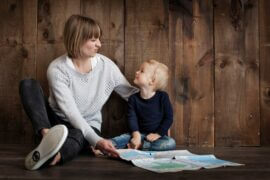 mom with young son looking at map