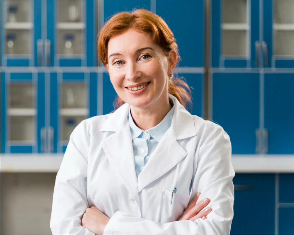 A friendly female optometrist in a white lab coat, standing in a modern clinic. She is ready to assist patients in understanding eyeglass prescriptions and ensuring they receive the best vision care.