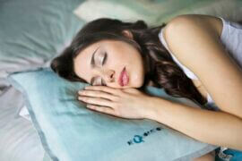 woman sleeping on pillow