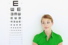 woman standing next to eye chart