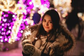 woman with sparkler on new years eve