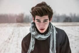 young man in snowy field